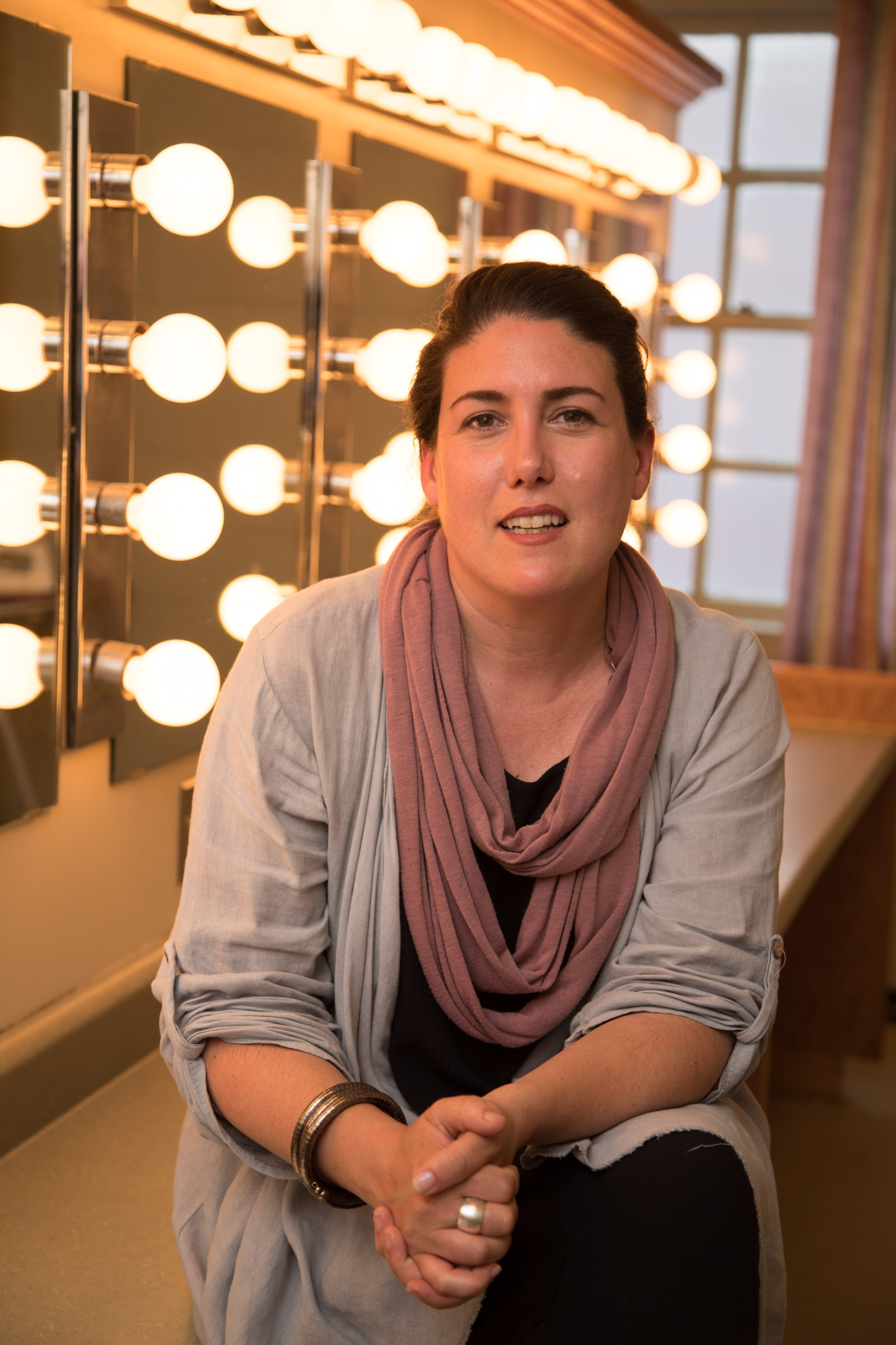 Tania Breen sits in front of the Playhouse dressing room mirrors with lights