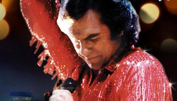 Person dressed as Neil Diamond
