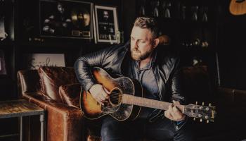 Johnny Reid playing the guitar.