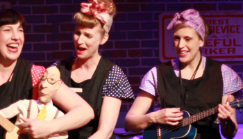 Three performers with a puppet in Somebody Loves You Mr.Hatch