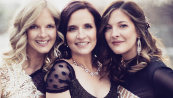 Three sisters with their faces close to each other
