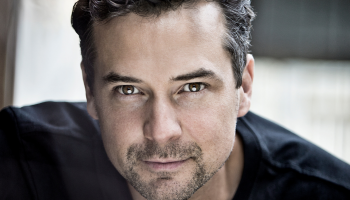 Close up image of Michael Kaeshammer in a black shirt