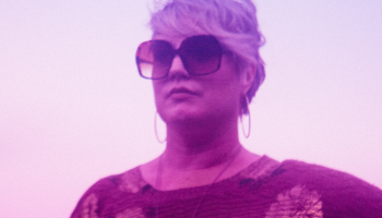 Erin Costelo under a magenta filter