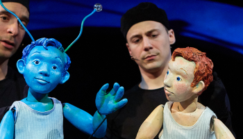 Two puppeteers with puppets in Marco Bleu