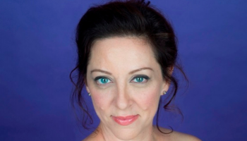 Head shot of a woman smiling.