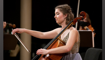 A woman playing a cello.