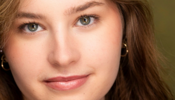 Head shot of a woman smiling.