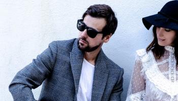 Raine Maida & Chantal Kreviazuk looking at something to their right.