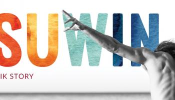 A person facing away from the camera, arms outstretched. The word Pisuwin in colourful letters along the back of the image.