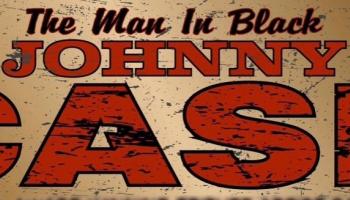 Gold Background, the words 'The Man In Black' in black font and the words 'Johnny Cash' in large red block print.