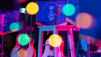 A colourful image of instruments set up on a stage.