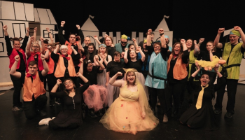 An image of the cast of Magic Beans on stage in costume.