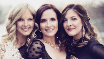 The Ennis Sisters centered with soft toned lighting.