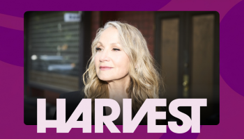 An image of Joan Osborne centered over a pink and purple background. The word HARVEST in light purple below Joan's image.