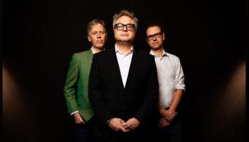 The Steven Page trio pose, facing the camera.