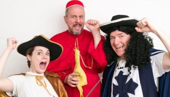Three DuffleBag actors are dressed in period costumes, making funny faces to the camera