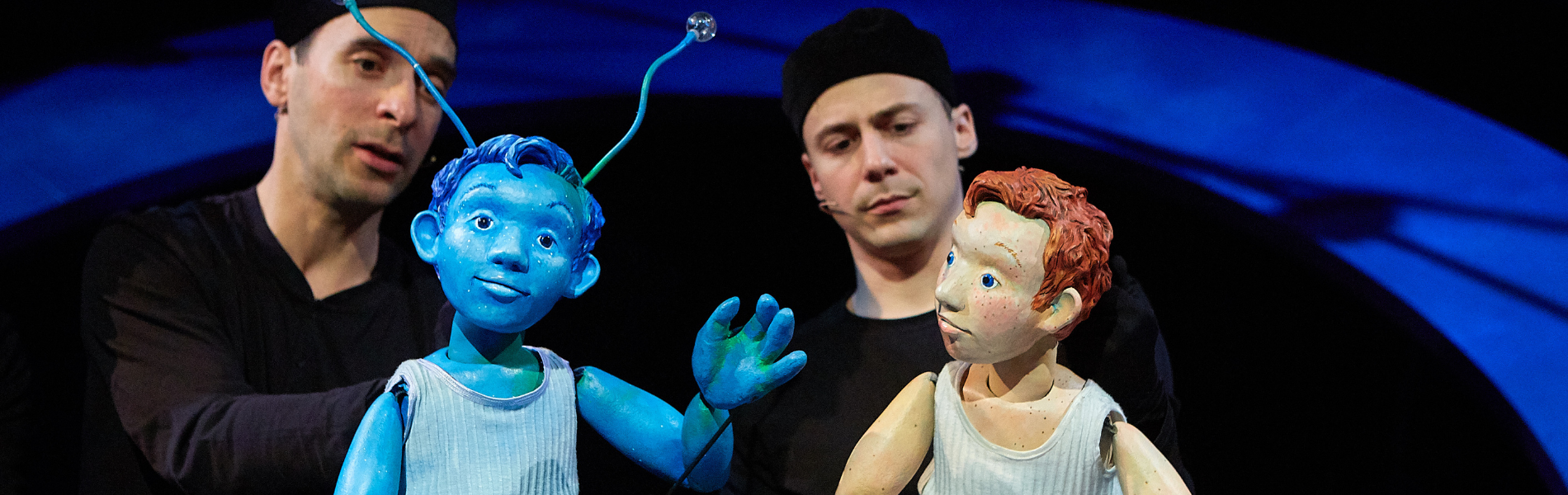 Two puppeteers with puppets in Marco Bleu