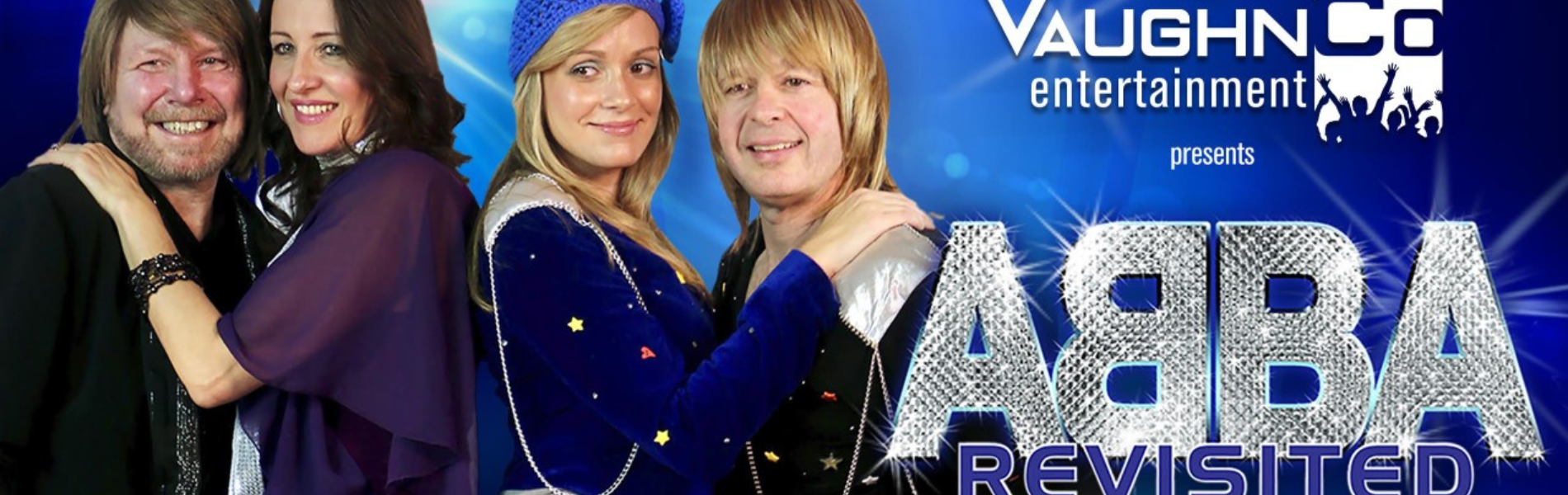 Two couples dressed up as ABBA members with the words ABBA Revisited in sparkling silver letters.