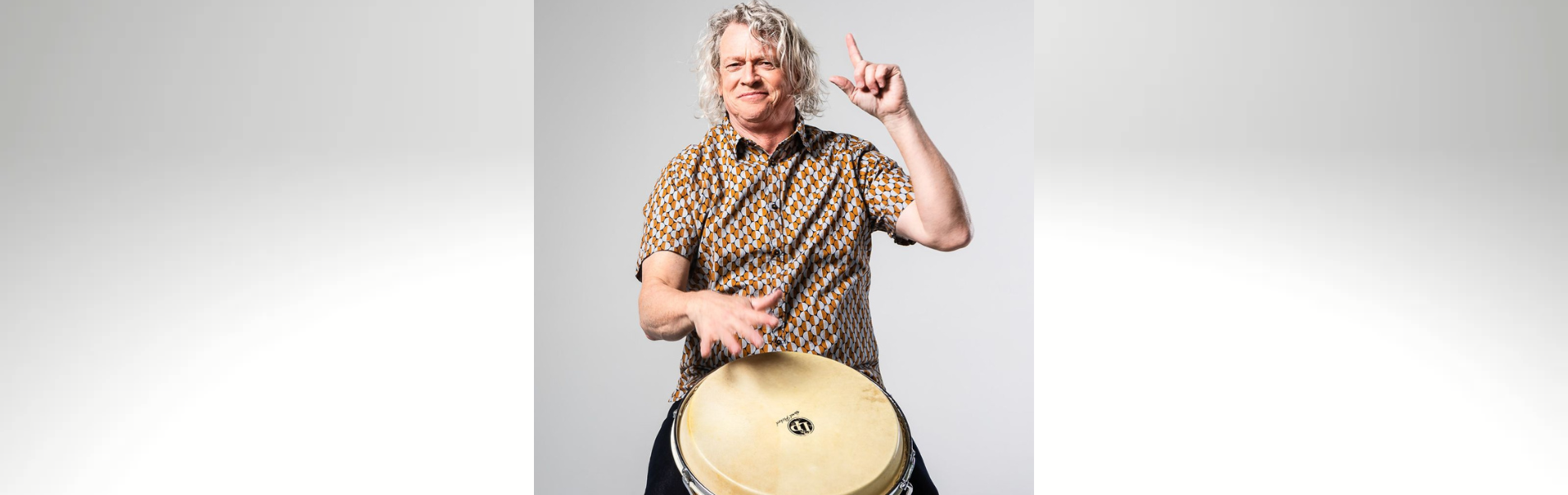 An image of Mr Mark playing a drum.