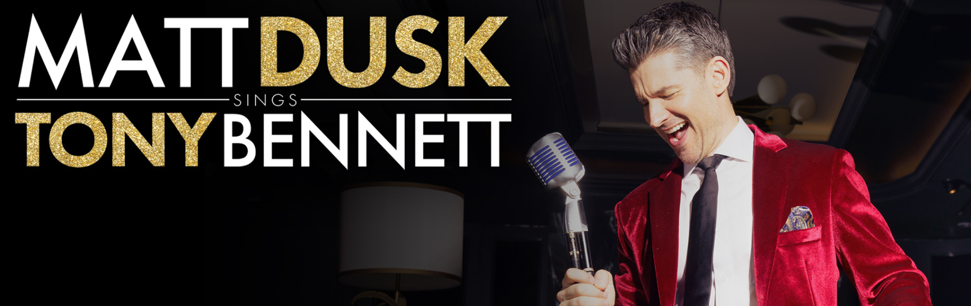 Matt Dusk in a red velvet jacket singing into an old fashioned microphone with the text "Matt Dusk sings Tony Bennett"