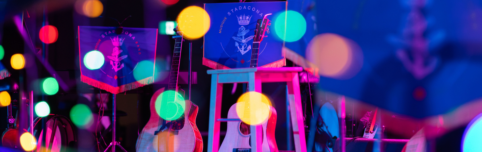 A colourful image of instruments set up on a stage.