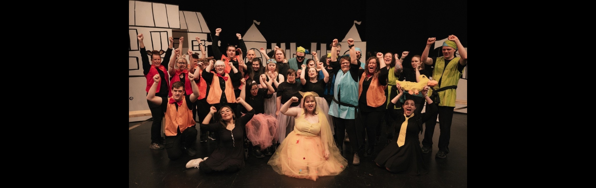 An image of the cast of Magic Beans on stage in costume.