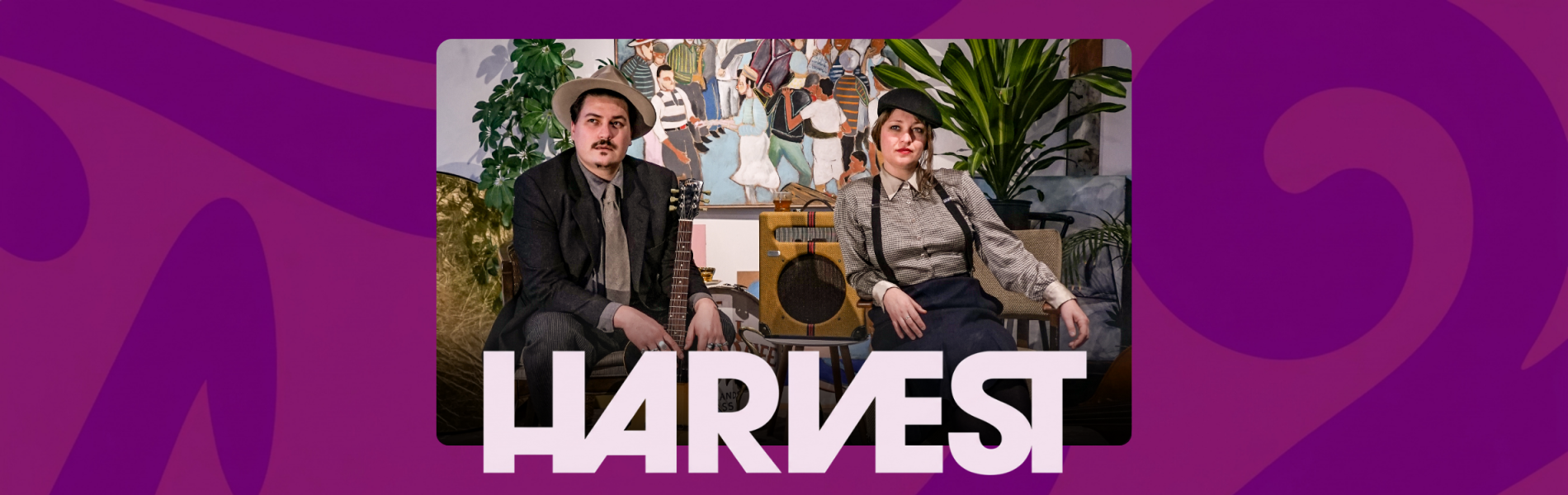 The two artists from Blue Moon Marquee lounge in chairs with plants behind them. The word HARVEST below their photo.