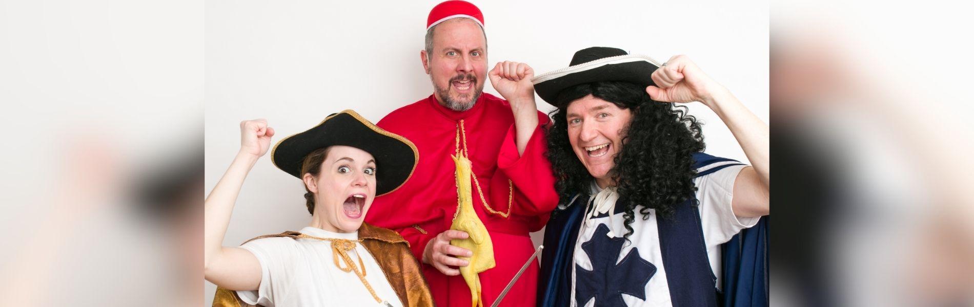 Three DuffleBag actors are dressed in period costumes, making funny faces to the camera